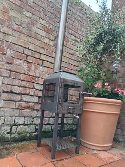 Cube stove outdoors by Fire Pit Stop NI